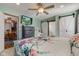 Main bedroom with barn door, dresser, and view of dining area at 1801 Witt Rd, Lebanon, IN 46052