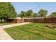 View of the side yard with a wooden fence and gate at 1801 Witt Rd, Lebanon, IN 46052