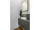 Small bathroom with a modern vanity and a large mirror at 210 N Beville Ave, Indianapolis, IN 46201