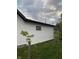 White vinyl siding with black window frames on the side of the house at 2722 Collier St, Indianapolis, IN 46241