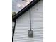 White vinyl siding with black window frames and electric meter at 2722 Collier St, Indianapolis, IN 46241