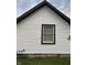 White vinyl siding with black window frames on the side of the house at 2722 Collier St, Indianapolis, IN 46241