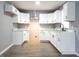 Modern white kitchen with stainless steel appliances and marble countertops at 2817 S Rybolt Ave, Indianapolis, IN 46241