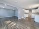 Open concept kitchen and living area with gray walls and wood floors at 2817 S Rybolt Ave, Indianapolis, IN 46241