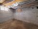 Unfinished basement with exposed beams and concrete walls at 3156 Graceland Ave, Indianapolis, IN 46208