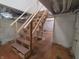Unfinished basement with exposed utilities and wooden stairs at 3156 Graceland Ave, Indianapolis, IN 46208