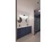 Elegant bathroom with dual vanity, marble floors, and walk-in shower at 3156 Graceland Ave, Indianapolis, IN 46208