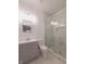 Updated bathroom with gray vanity and a large walk-in shower at 3156 Graceland Ave, Indianapolis, IN 46208