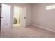 Cozy bedroom with neutral decor and access to a bathroom at 3156 Graceland Ave, Indianapolis, IN 46208