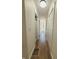 Bright hallway with hardwood floors and white doors at 3156 Graceland Ave, Indianapolis, IN 46208