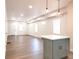 Spacious living room with hardwood floors and an island at 3156 Graceland Ave, Indianapolis, IN 46208
