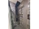 Modern shower with rainfall showerhead and dark tile surround at 3156 Graceland Ave, Indianapolis, IN 46208