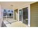 Back porch with sliding glass door and wood decking at 3415 Delmar Ave, Indianapolis, IN 46241