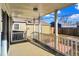 Covered back porch with white railings and wood decking at 3415 Delmar Ave, Indianapolis, IN 46241