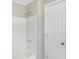 Simple bathroom with a tub and shower at 3415 Delmar Ave, Indianapolis, IN 46241