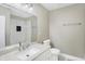 Modern bathroom with white vanity, toilet and walk-in shower at 3415 Delmar Ave, Indianapolis, IN 46241
