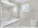 Modern bathroom with white vanity and updated fixtures at 3415 Delmar Ave, Indianapolis, IN 46241