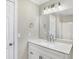 Updated bathroom with white vanity and quartz countertop at 3415 Delmar Ave, Indianapolis, IN 46241