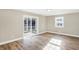 Bright bedroom with hardwood floors and sliding glass doors leading to a deck at 3415 Delmar Ave, Indianapolis, IN 46241