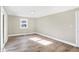 Well-lit bedroom with hardwood floors and a window at 3415 Delmar Ave, Indianapolis, IN 46241
