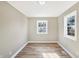 Charming bedroom with two windows and wood flooring at 3415 Delmar Ave, Indianapolis, IN 46241