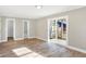 Spacious bedroom with hardwood floors and access to bathroom and deck at 3415 Delmar Ave, Indianapolis, IN 46241
