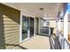 Covered deck with wood flooring and sliding glass doors at 3415 Delmar Ave, Indianapolis, IN 46241