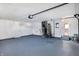 Spacious garage with painted floor and ample storage space at 3415 Delmar Ave, Indianapolis, IN 46241