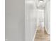 Bright hallway with light walls and wood-look flooring at 3415 Delmar Ave, Indianapolis, IN 46241