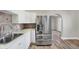 Modern kitchen with stainless steel appliances and white cabinets at 3415 Delmar Ave, Indianapolis, IN 46241