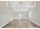 Spacious living room with vaulted ceilings and hardwood floors at 3415 Delmar Ave, Indianapolis, IN 46241