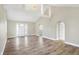 Spacious living room with hardwood floors and an archway at 3415 Delmar Ave, Indianapolis, IN 46241