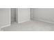 Bright bedroom features neutral walls, plush carpet, and a glimpse into a walk-in closet at 4068 Berry Chase Blvd, Greenwood, IN 46143