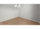 Cozy dining area with modern light fixture and wood floors at 4068 Berry Chase Blvd, Greenwood, IN 46143