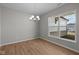 Bright dining room with elegant chandelier and large window at 4068 Berry Chase Blvd, Greenwood, IN 46143