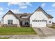 New construction home featuring white siding, a two-car garage, and a well manicured front lawn at 4068 Berry Chase Blvd, Greenwood, IN 46143