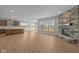 Bright living room with wood floors, a stone fireplace, and large windows at 4068 Berry Chase Blvd, Greenwood, IN 46143