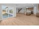 Spacious living room with sliding glass doors, wood floors, and views of backyard at 4068 Berry Chase Blvd, Greenwood, IN 46143