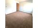 Spacious carpeted bedroom with neutral walls and ample closet space at 621 Meadows Edge Ln, Indianapolis, IN 46217