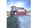 Two-story house with red and beige siding, attached garage, and front porch at 621 Meadows Edge Ln, Indianapolis, IN 46217