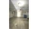 Empty two car garage with concrete floor at 621 Meadows Edge Ln, Indianapolis, IN 46217
