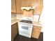 White stove and oven with wood cabinets at 621 Meadows Edge Ln, Indianapolis, IN 46217
