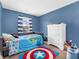 Blue bedroom with twin bed and dresser at 6232 Emerald Springs Dr, Indianapolis, IN 46221