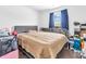 Bedroom with queen bed and large window at 6232 Emerald Springs Dr, Indianapolis, IN 46221