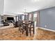 Dining area with a wooden table and chairs, near the kitchen at 6232 Emerald Springs Dr, Indianapolis, IN 46221
