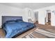 Spacious main bedroom with a large bed and walk-in closet at 6232 Emerald Springs Dr, Indianapolis, IN 46221