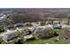 Desirable neighborhood aerial view with mature trees, sidewalks, and manicured lawns at 7709 Santolina Dr, Indianapolis, IN 46237