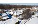 Aerial view of a residential neighborhood with snow-covered houses and yards at 7709 Santolina Dr, Indianapolis, IN 46237