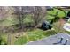 Aerial view showcasing the backyard, shed, and green space with mature trees in a desirable neighborhood at 7709 Santolina Dr, Indianapolis, IN 46237