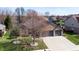 Aerial view of a beautiful home with a well-manicured lawn and a spacious driveway at 7709 Santolina Dr, Indianapolis, IN 46237